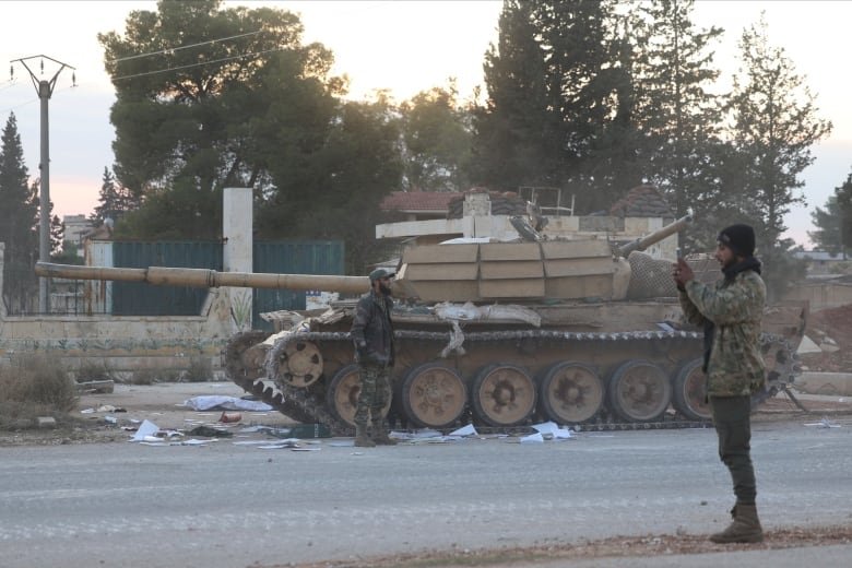 Opposition forces seen outside Aleppo, Syria, on Friday, Nov. 29, 2024.