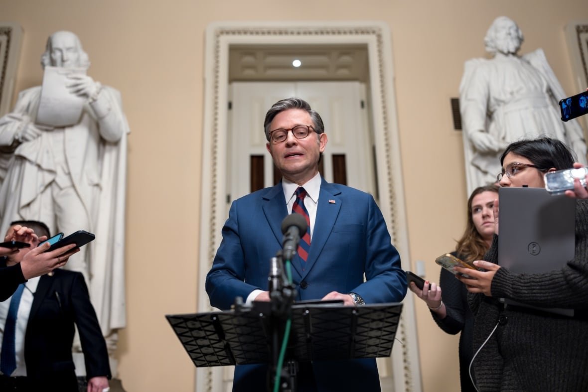 U.S. House Speaker Mike Johnson speaks to reporters ahead of a vote on an interim spending bill at the U.S. Capitol building in Washington.