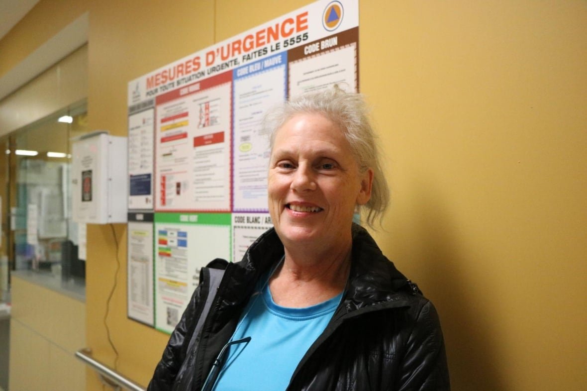 bagger-patient-navigator-image-5-1 A woman smiling inside of a hospital.