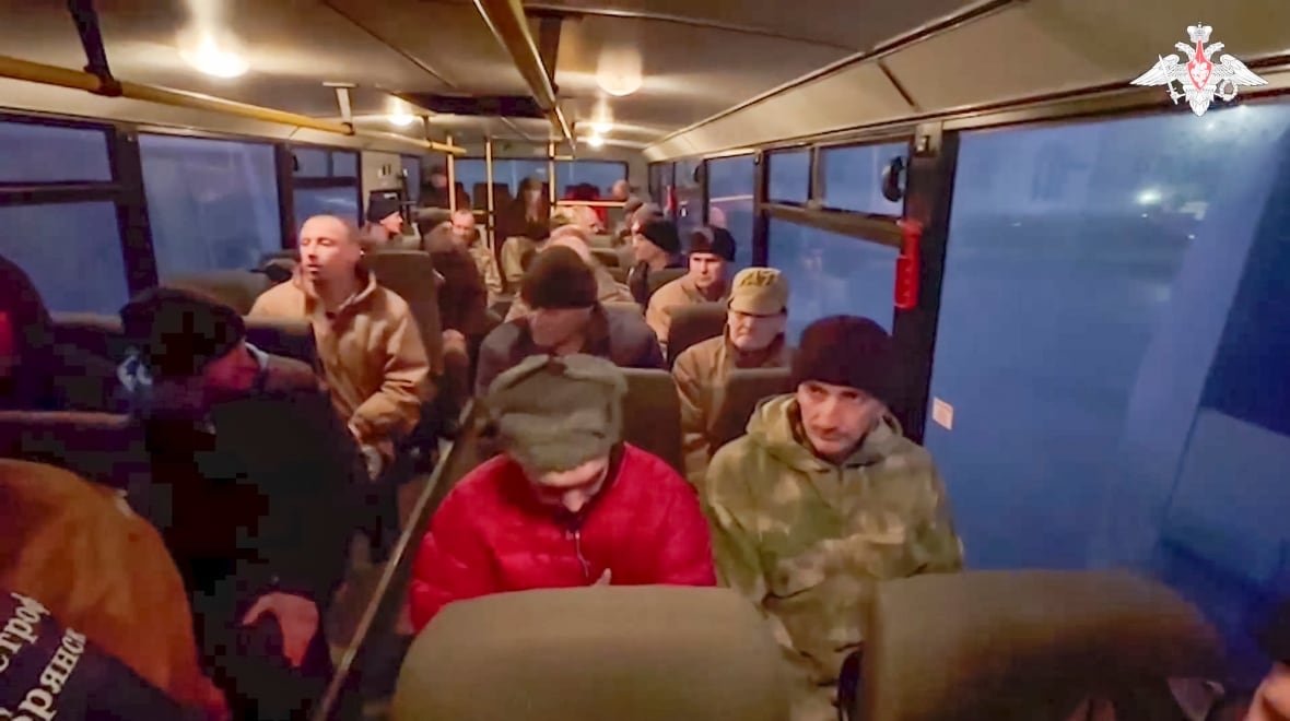 belarus-russia-ukraine-pow-exchange-1 In this photo taken from video released by the Russian Defense Ministry Press Service on Monday, a group of Russian soldiers sit in a bus after being released in a prisoners swap between Russia and Ukraine, at an unspecified location in Belarus.