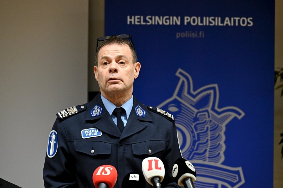 finland-estonia-power-7 A police officer in uniform speaks at a news conference.