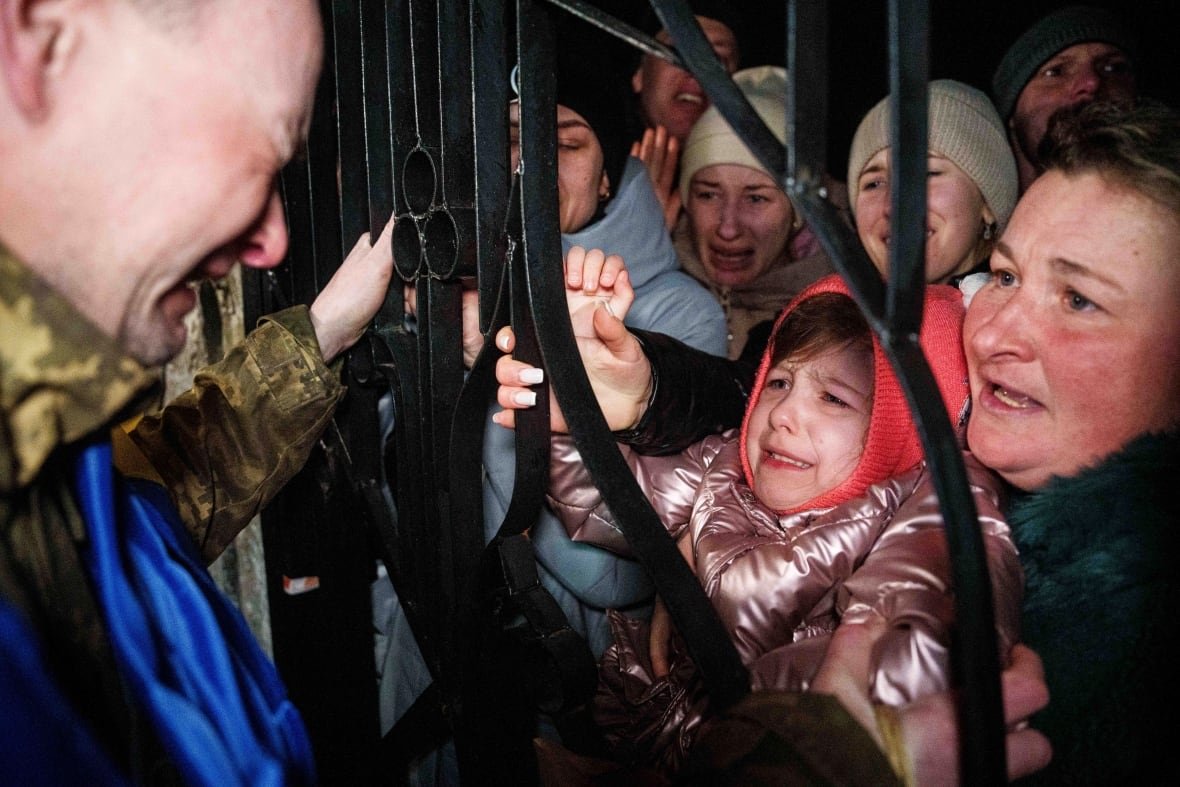 russia-ukraine-war-prisoners-1 A Ukrainian serviceman cries upon seeing his daughter after returning from captivity during a POWs exchange between Russia and Ukraine, in Ukraine on Monday.
