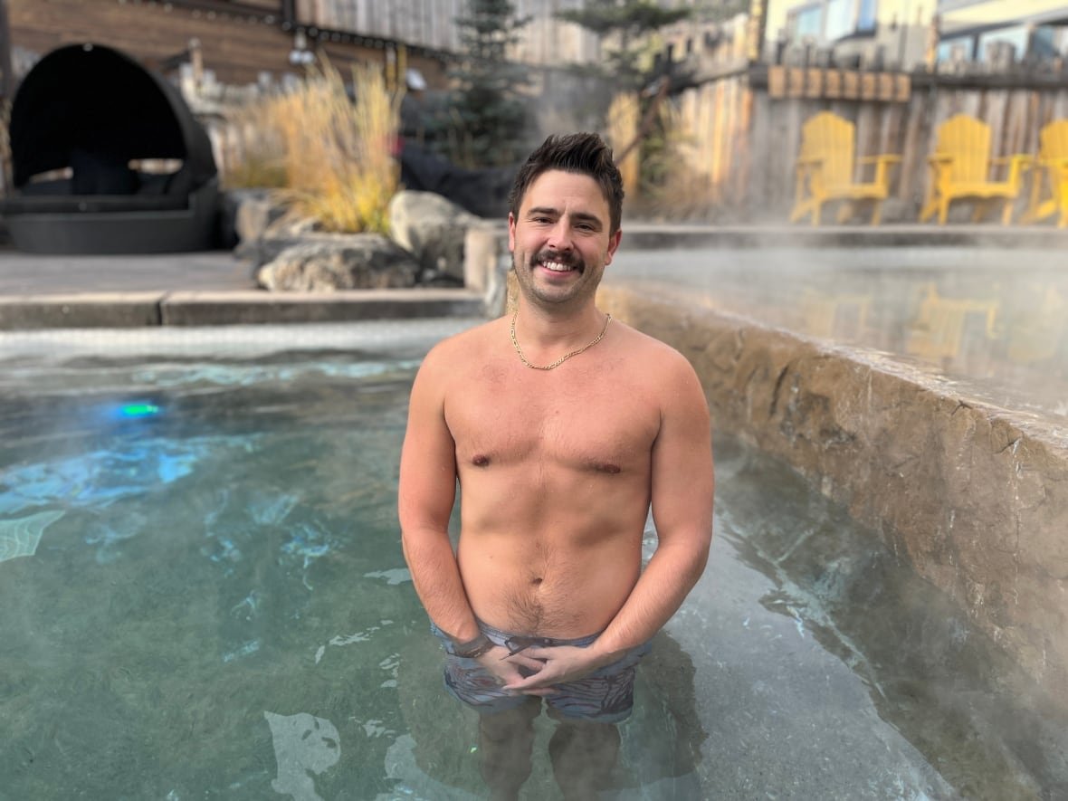 sam-pedlar A man is pictured inside the hot tub at the Kananaskis Nordic Spa in Alberta.