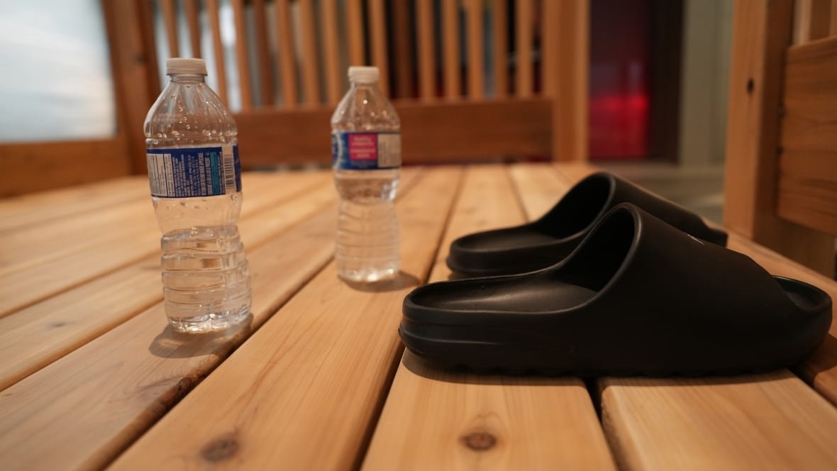 sandals-and-water-bottles-nordic-spa A pair of sandals and two water bottles are left outside a sauna at Calgary's Clear Nordic Spa.