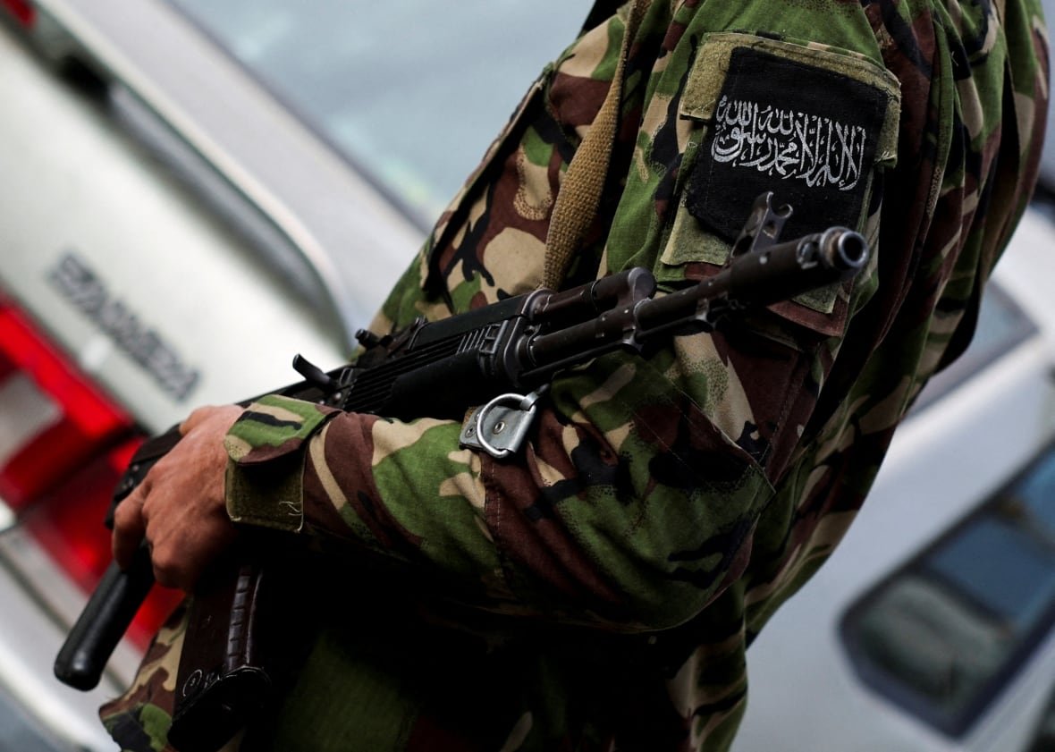 syria-security-5 A fighter of the ruling Syrian body is pictured carrying a rifle.