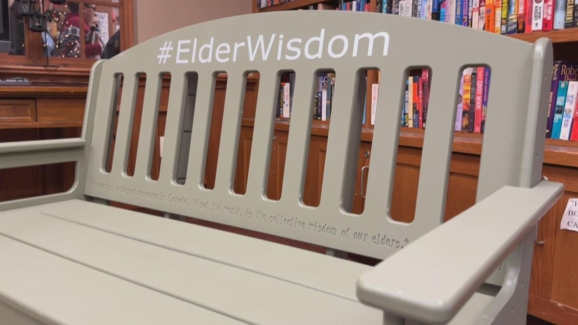 the-green-bench A light green bench has #ElderWisdom in white letters written on the back of it.