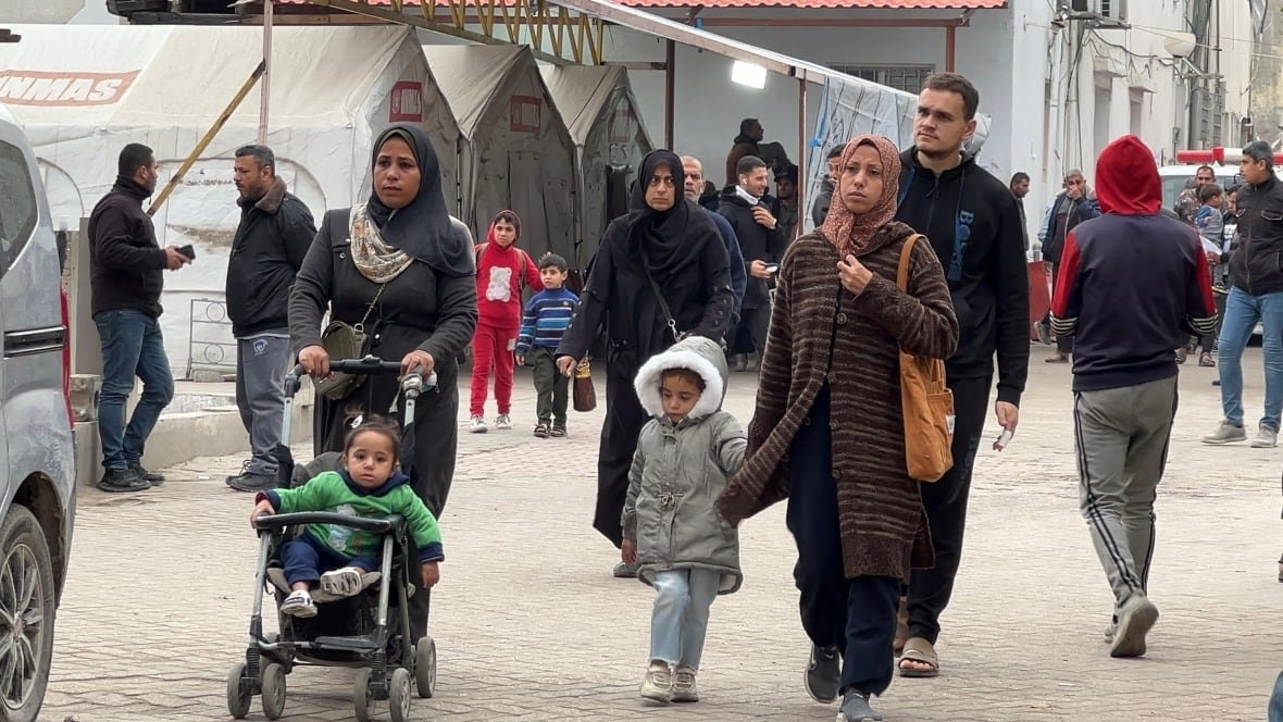 gaza-city-1 Families walking in Gaza City.