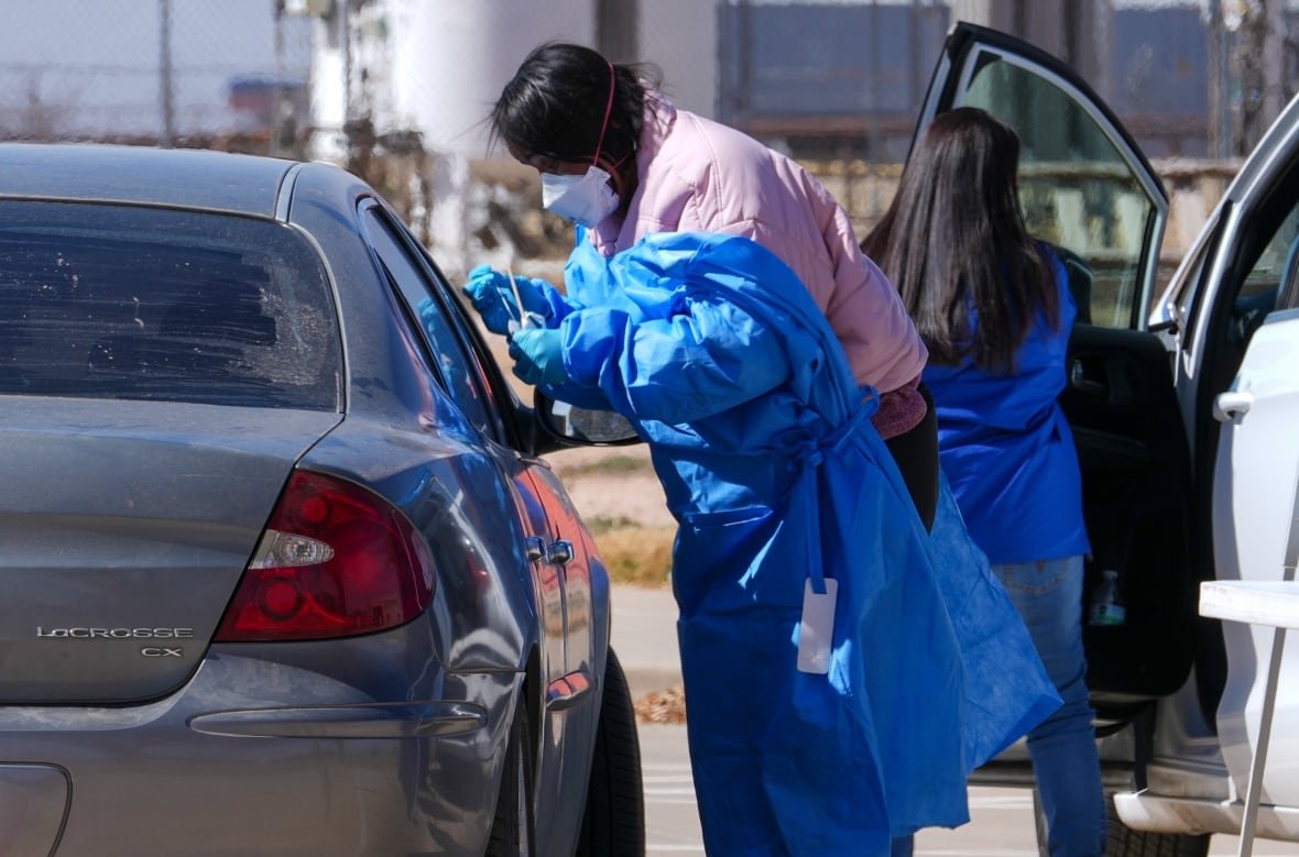 measles-outbreak-1 A health worker administers a measles test to a car passenger at a mobile testing site in Texas in February 2025.