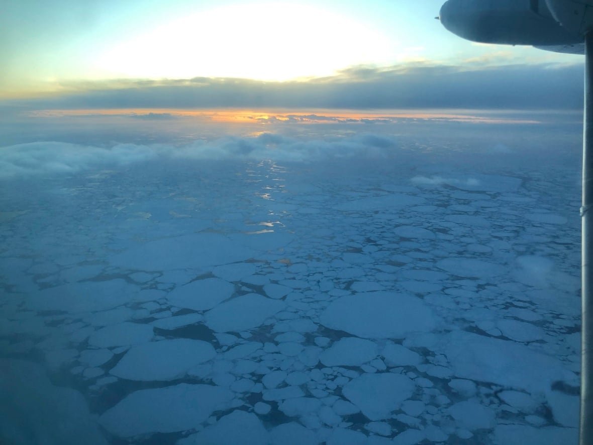 missing-plane-alaska Ice is visible in the Bering Sea at sunset.