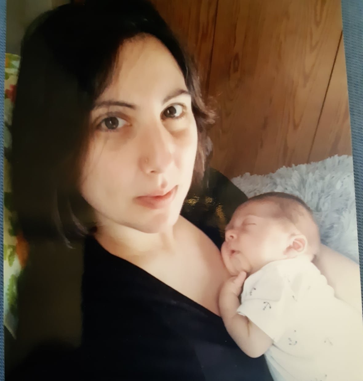stefania-seccia-and-max-seccia-smith-1 A woman holds a newborn infant against her chest.