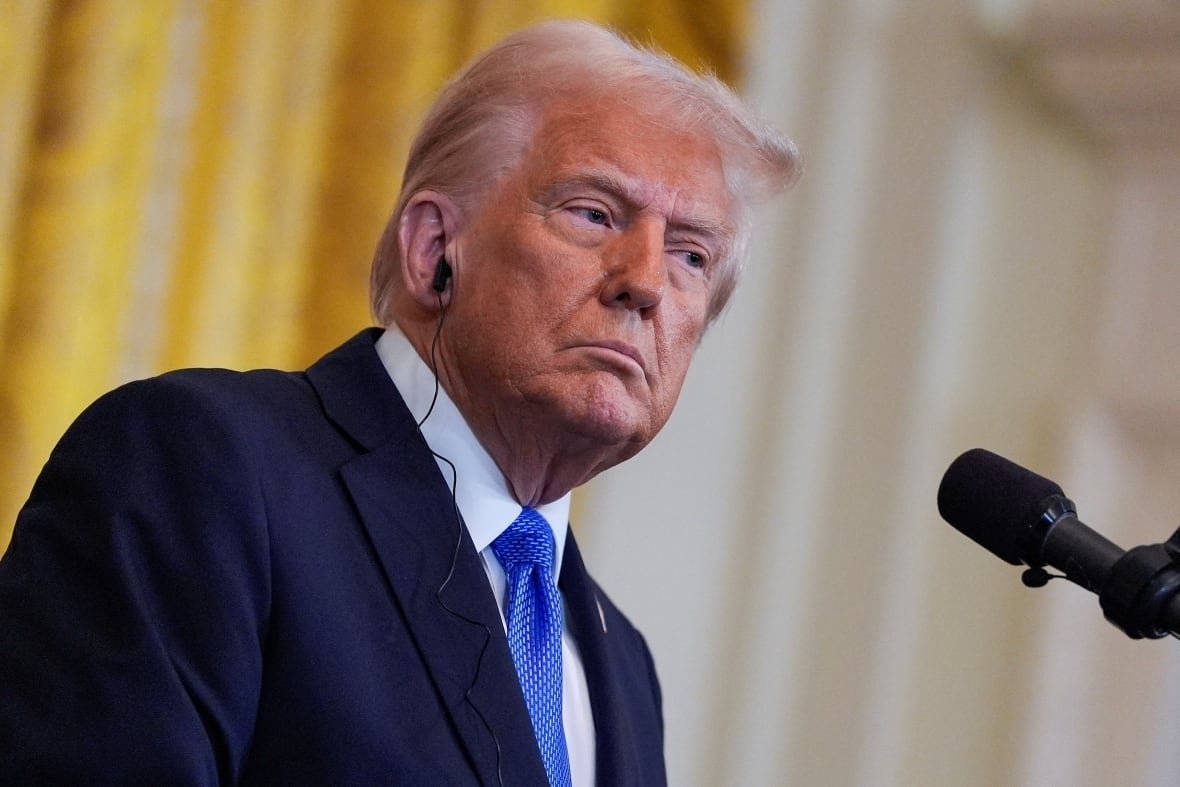 u-s-president-donald-trump-wearing-an-earpiece-during-a-news-conference-2 U.S. President Donald Trump, wearing an earpiece, during a news conference.