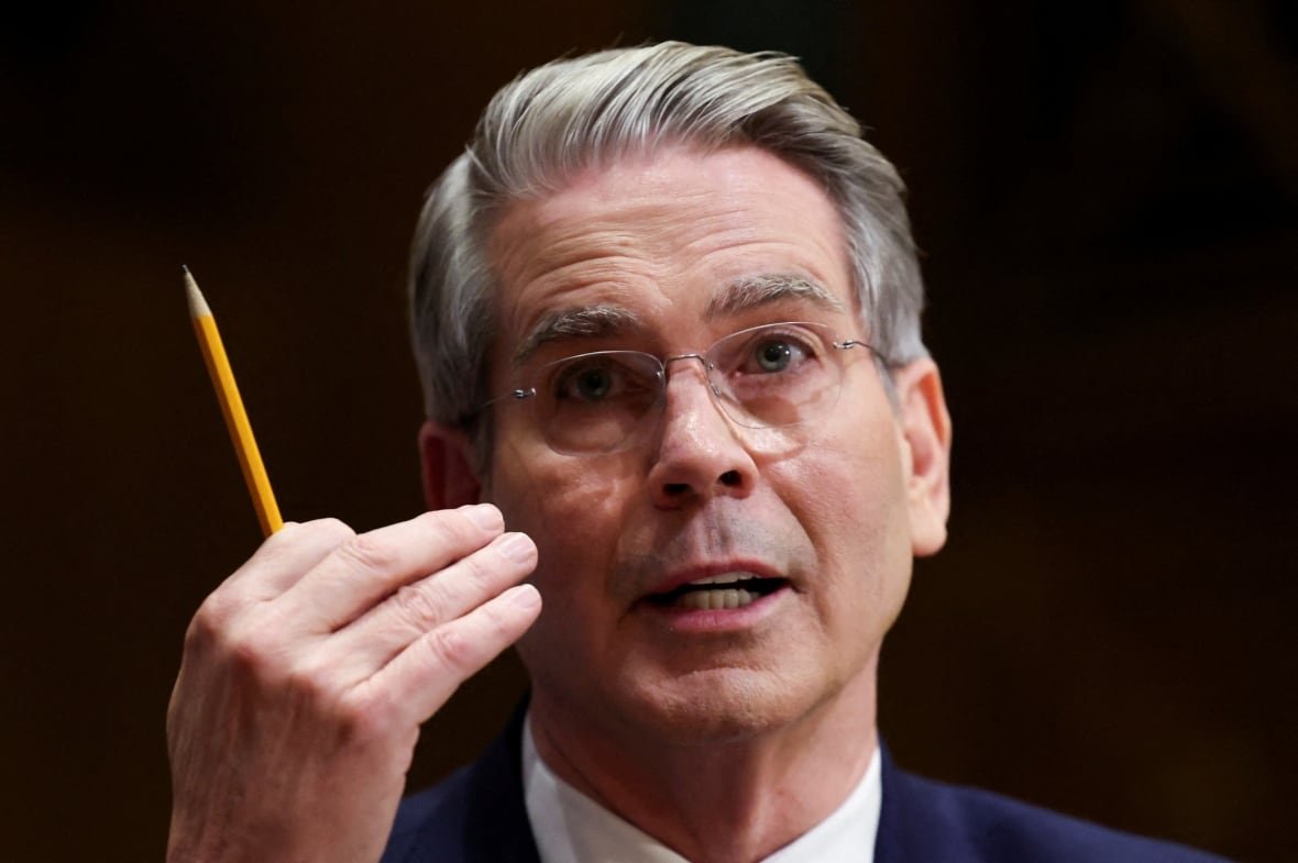 usa-trump-bessent-1 Man in glasses holds pencil