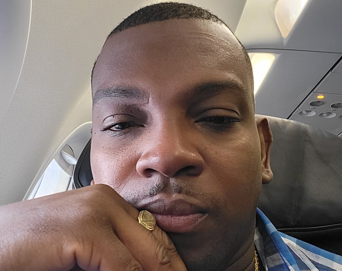 garth-jackson-1 Selfie of man seated on plane.