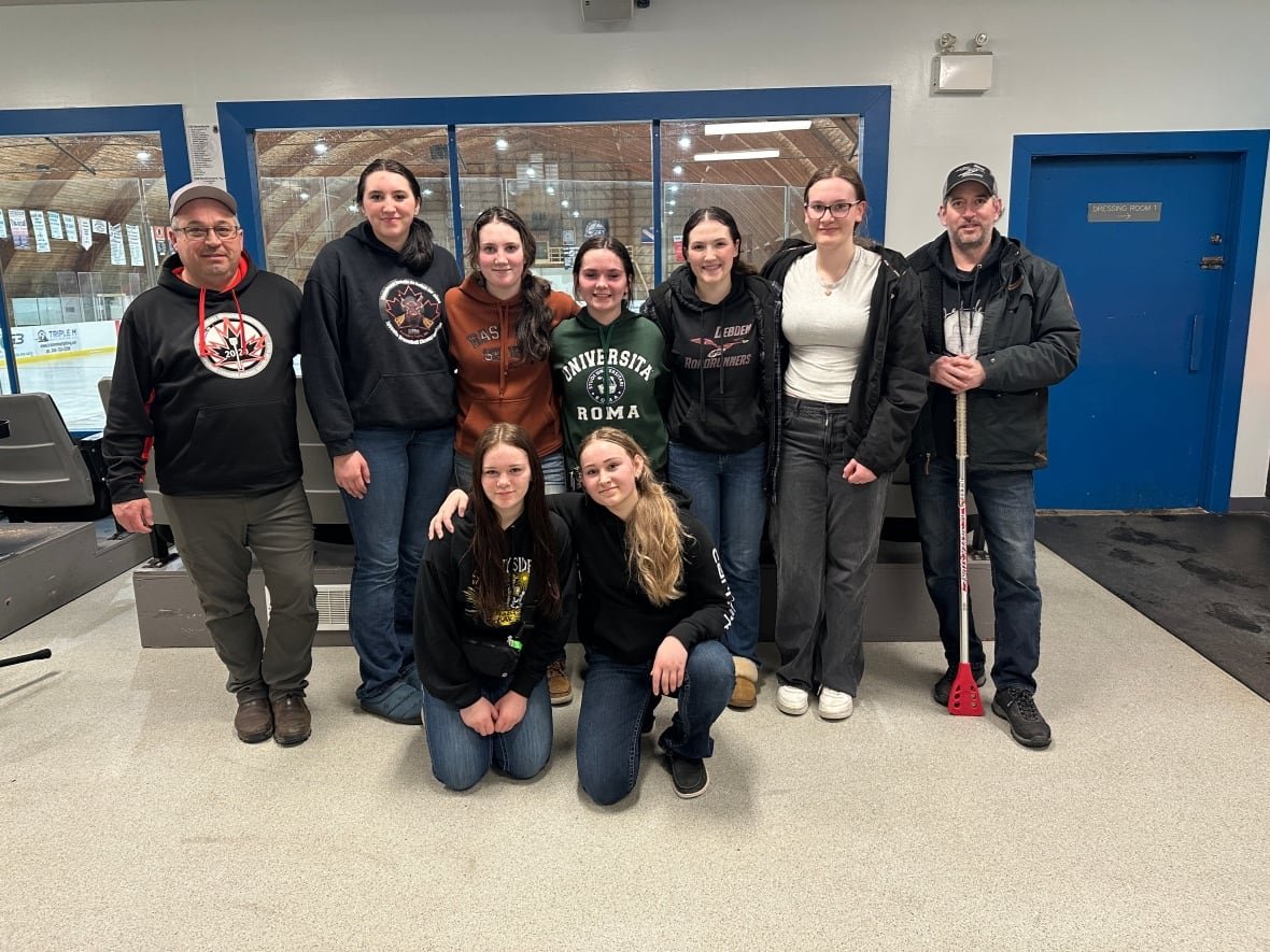 roadrunners A photo of a broomball team and coaches.