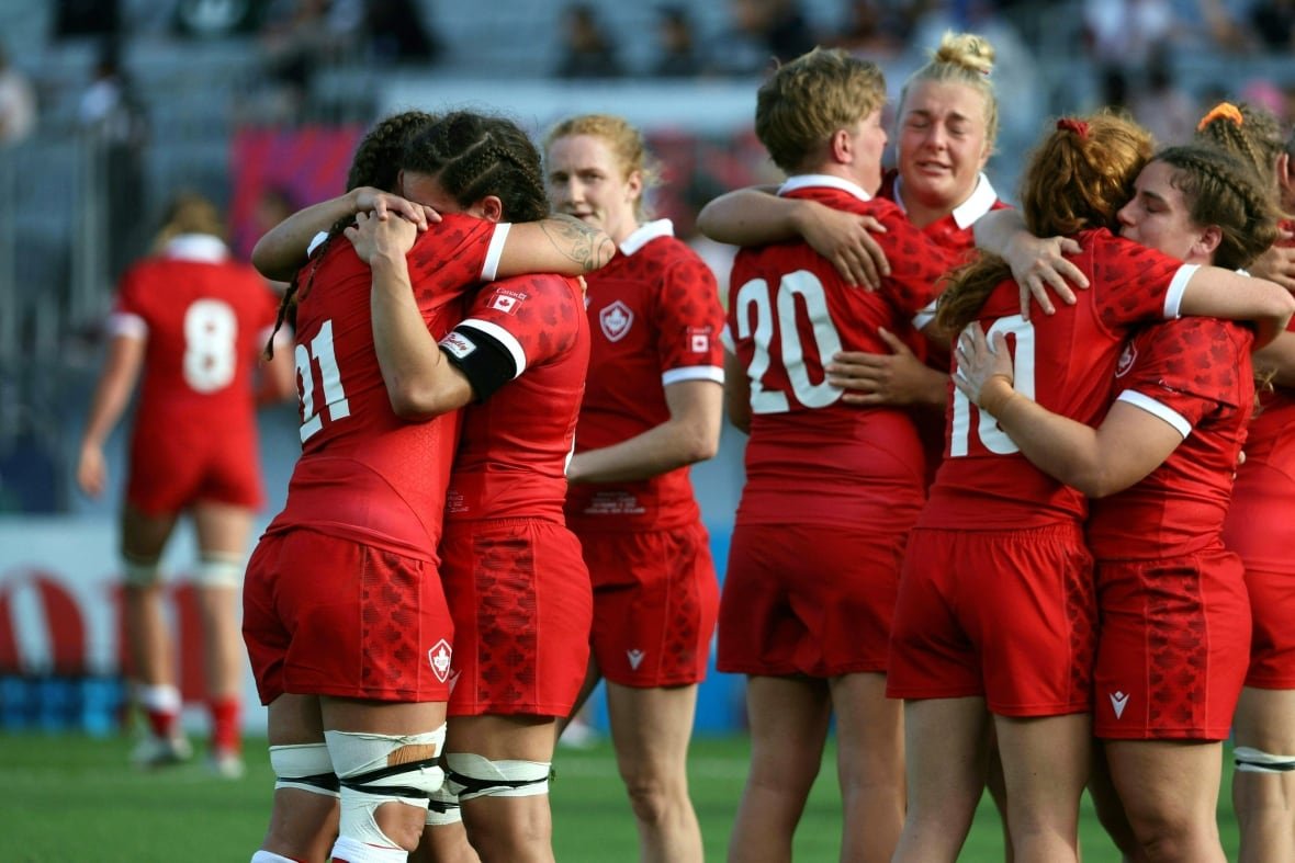 1244702764-1 A group of rugby players console each other after a loss.