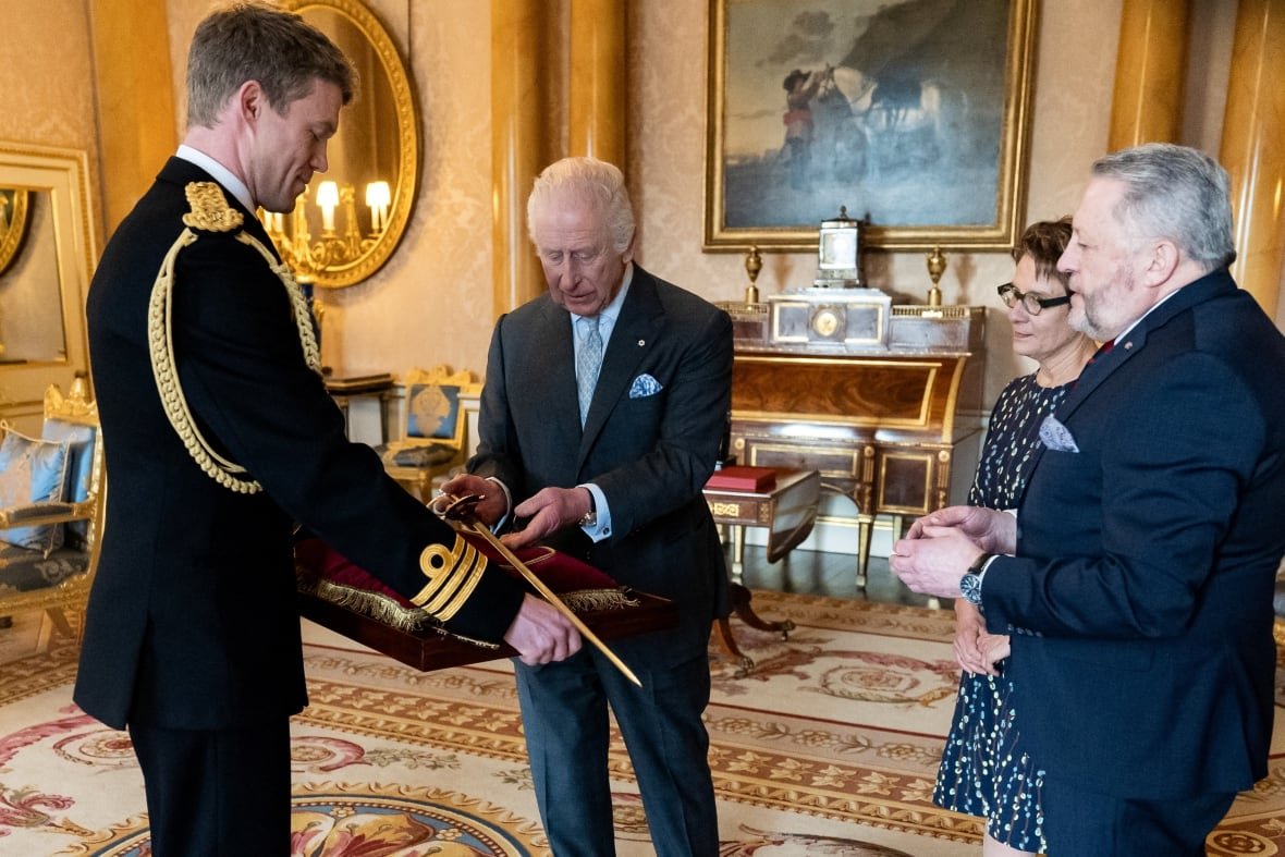 britain-royals-1 King Charles bestows a new ceremonial sword to the Usher of the Black Rod of the Senate of Canada Gregory Peters with Speaker of the Senate of Canada Raymonde Gagne present at Buckingham Palace, London, March 12, 2025.