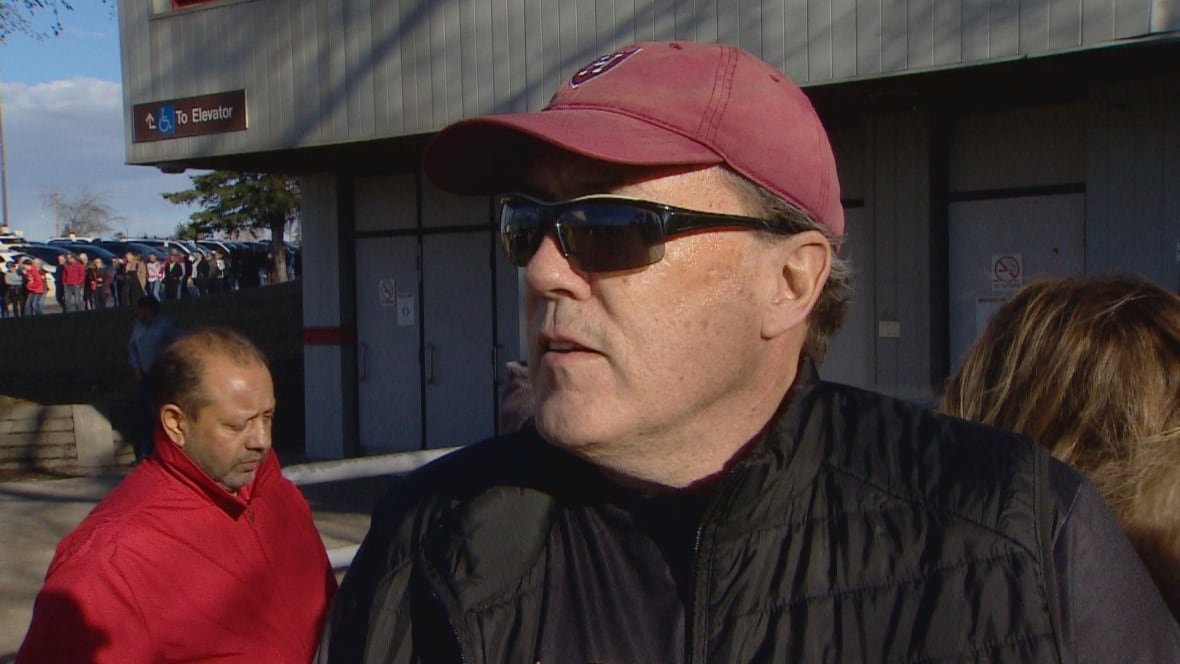 A man has sunglasses and a hat on.