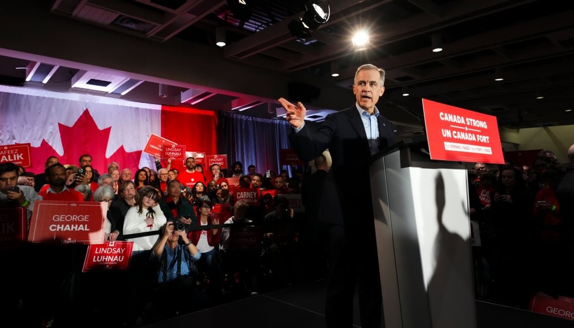 A man stands behind a podium.
