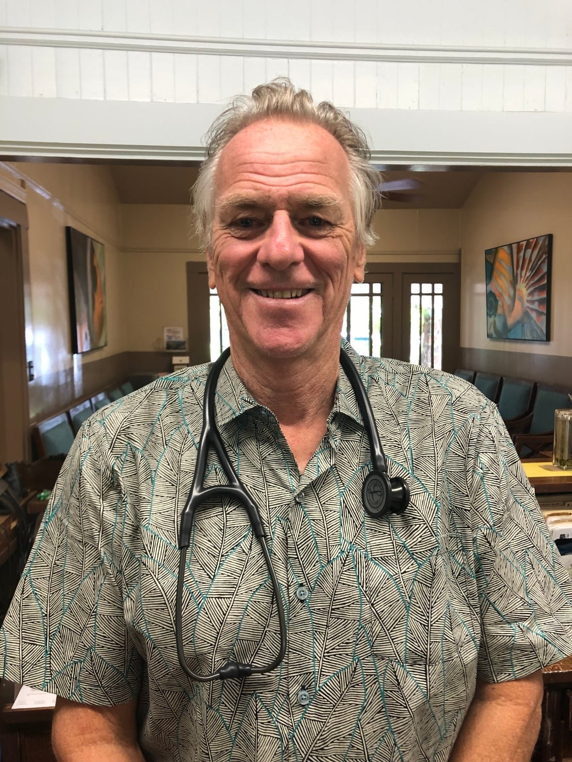 michael-murray A portrait of Michael Murray in his Hawaii clinic, pictured with a stethoscope around his neck.