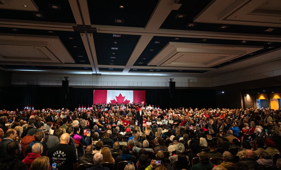 poilievre-london-rally-crowd-inside-1 Conservative Leader Pierre Poilievre speaks to a crowd of supporters during a "Bring It Home" rally in London, Ont., on March 9, 2025.