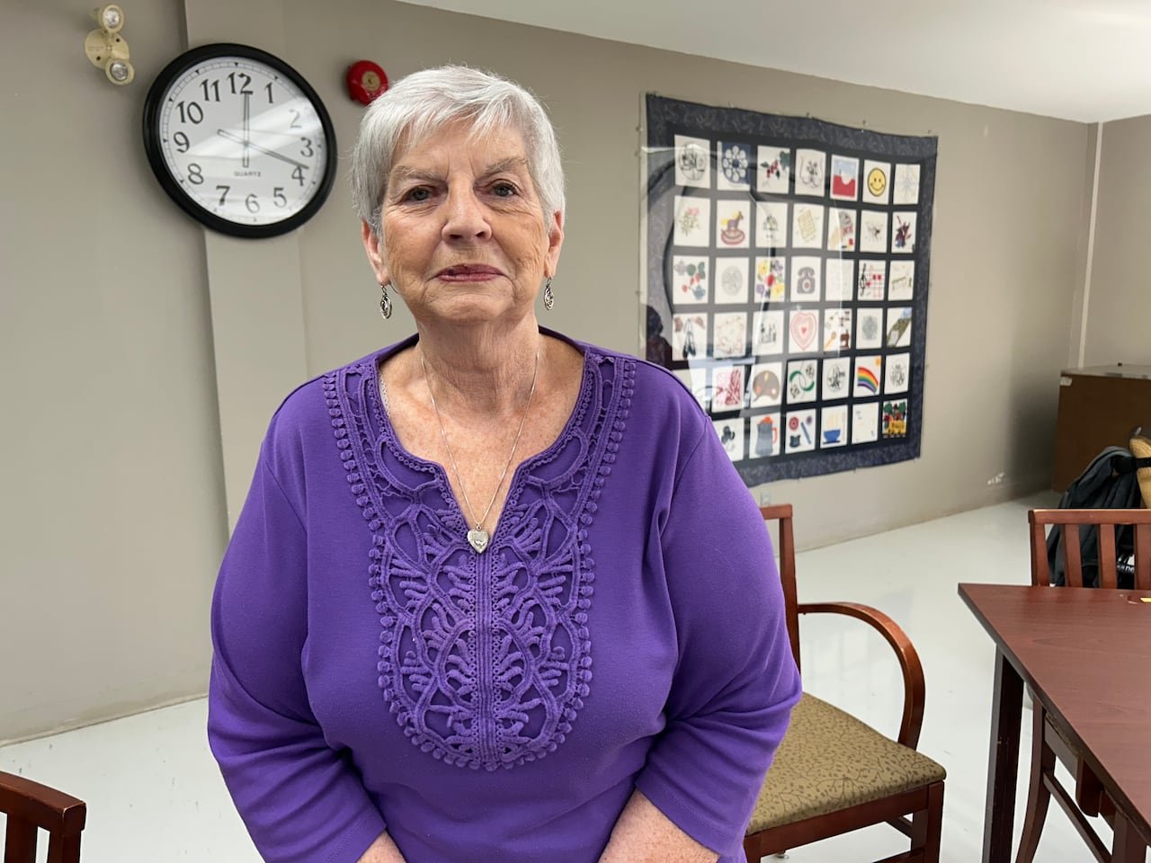 default-402 A woman sits in a chair.