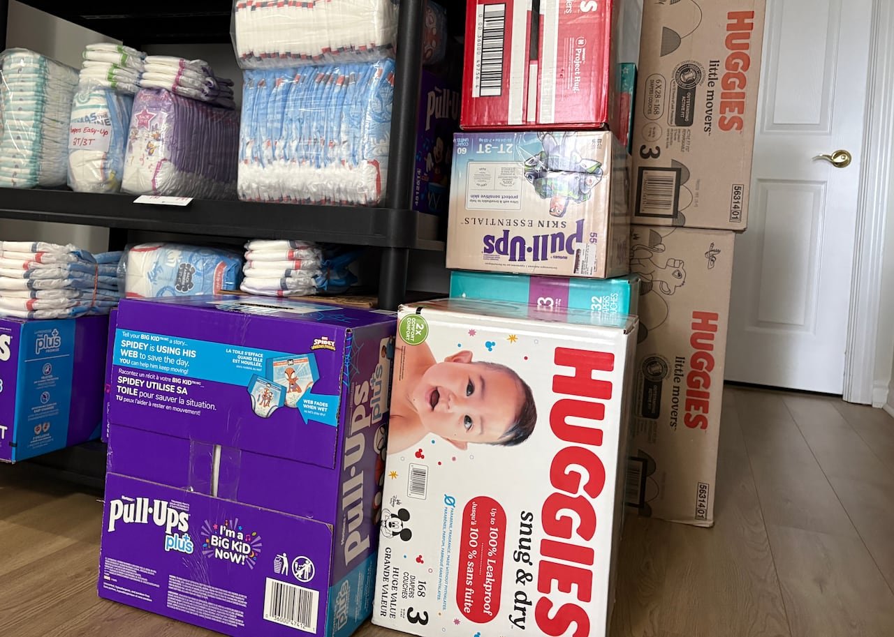 Diapers are piled up in a bedroom.