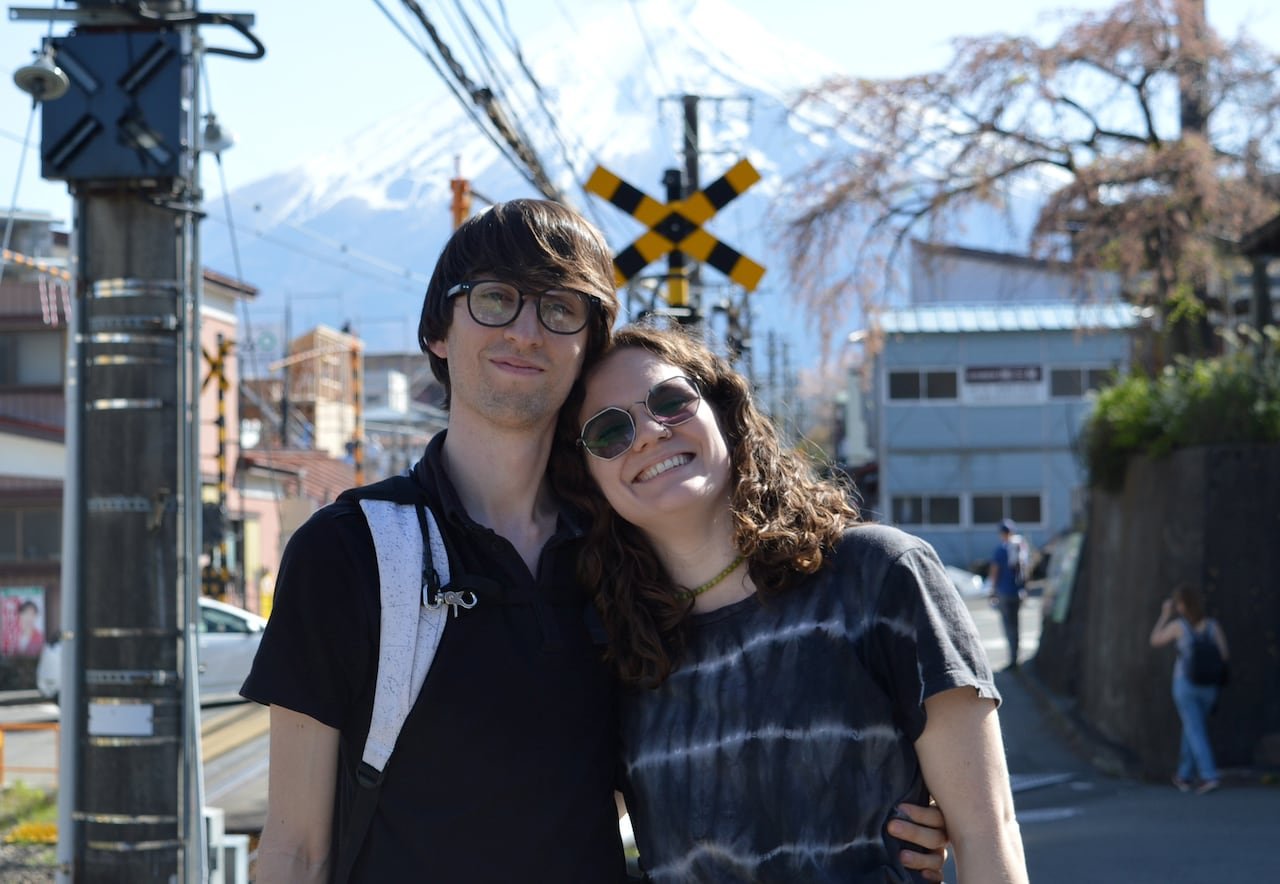 A young man and woman pose for a photo.