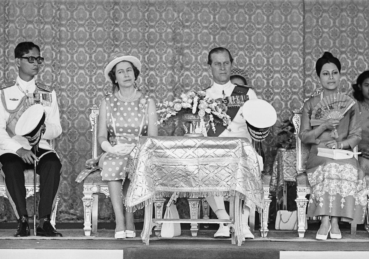 default-3195 People sit on chairs in this black and white photo.