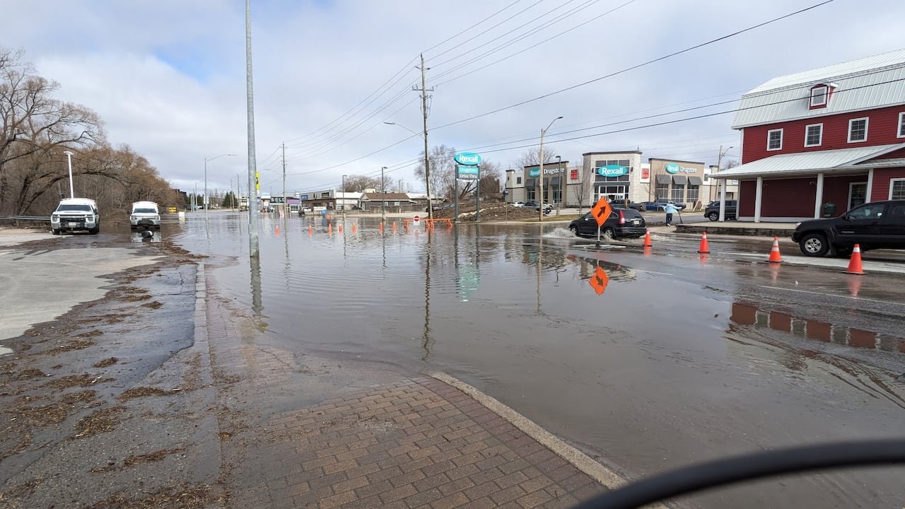 default-318 A flooded street with small businesses on the far end.