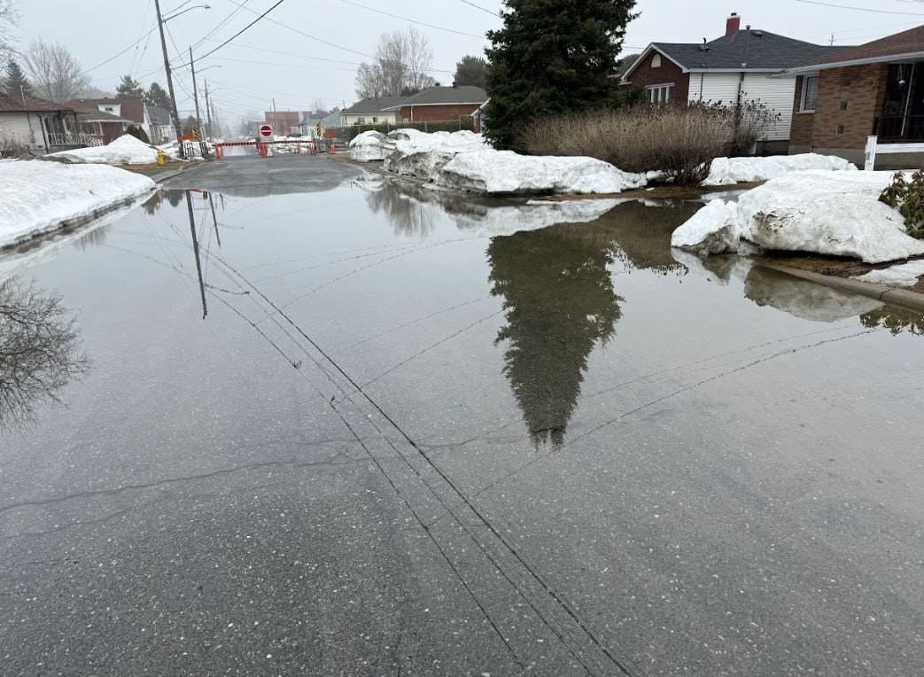 default-81 a street with houses on the side is covered with water