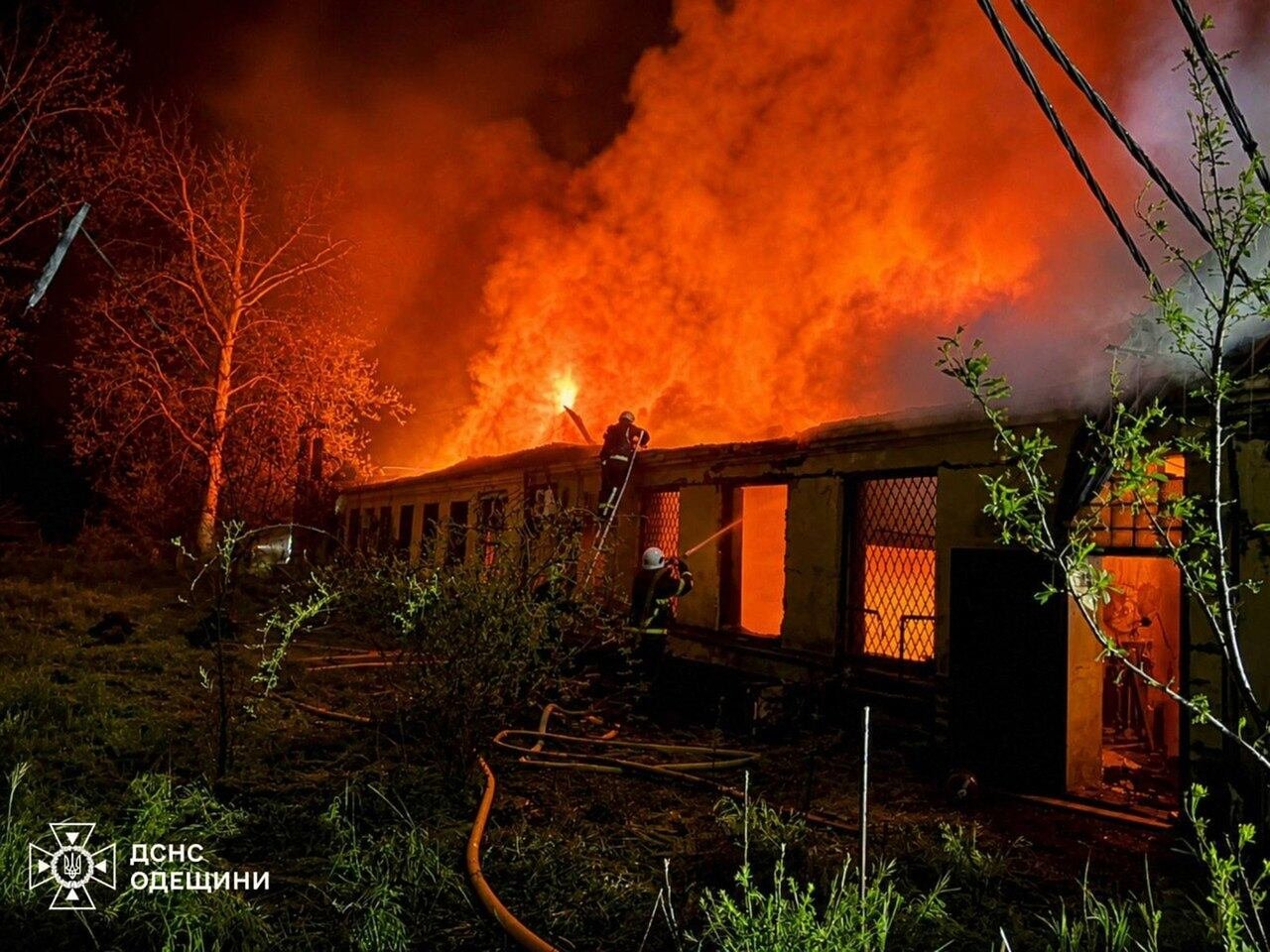 default-32 A fire engulfs a building at night.