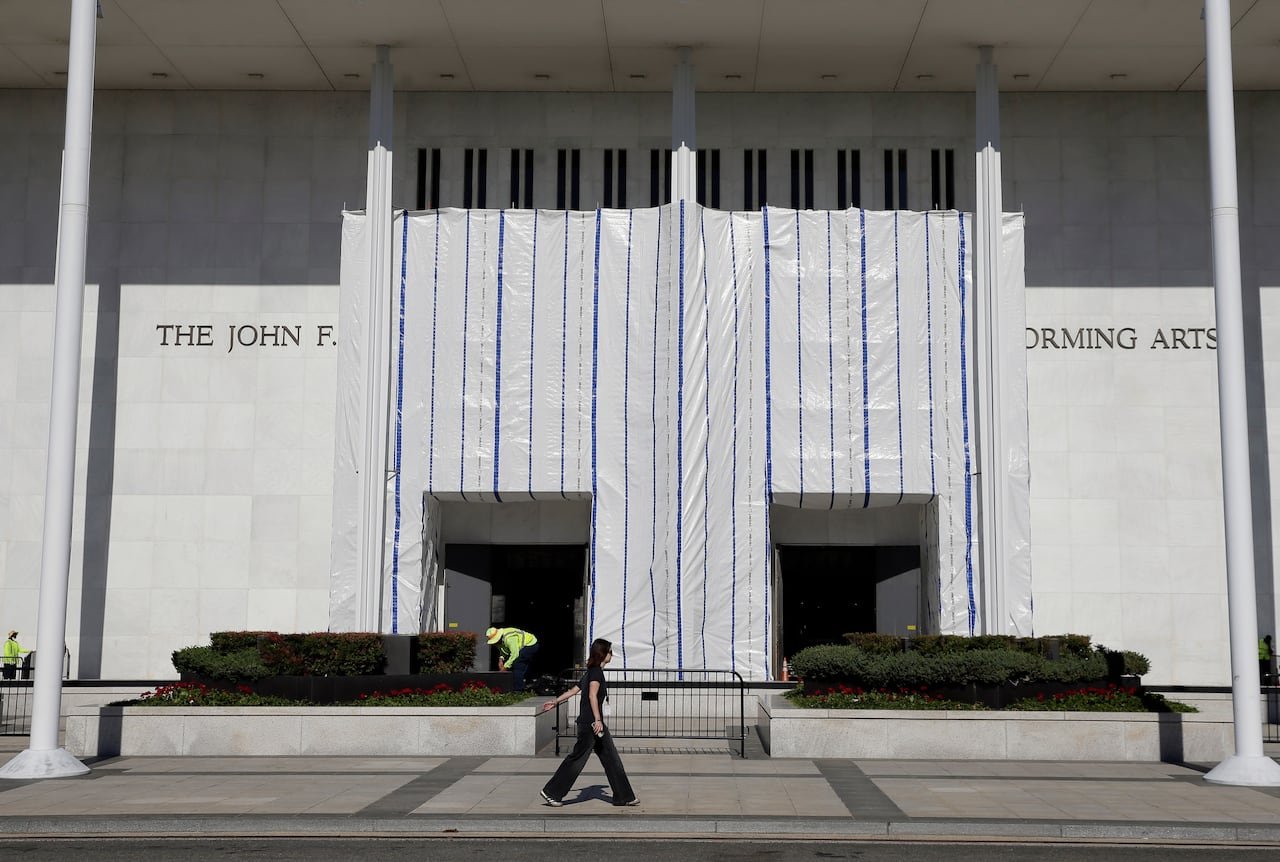default-69 A building with a large white tarp across the entrance is shown.